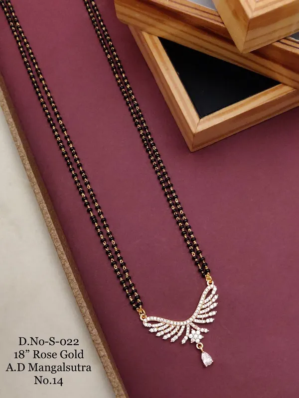 https://d1311wbk6unapo.cloudfront.net/NushopCatalogue/tr:f-webp,w-600,fo-auto/D-NO-S-022 ROSE GOLD AD 18 FANCY MANGALSUTRA_1684936623076_d0qruz3zi35b5pb.jpg__Ketmera